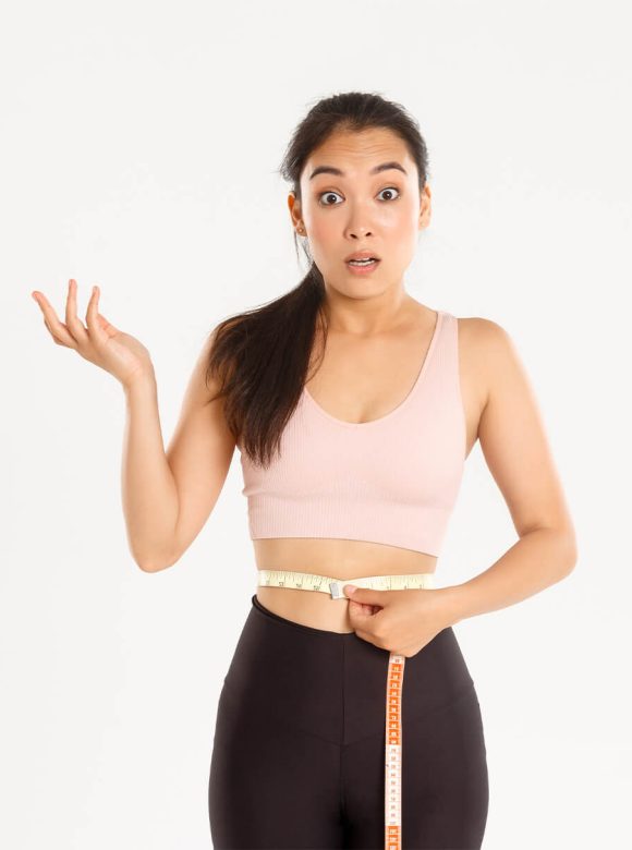 Woman holding measuring tape