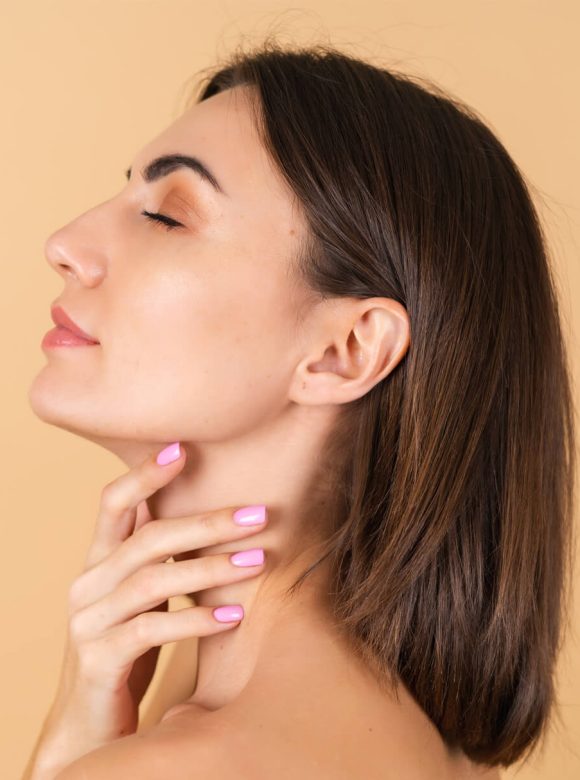 Woman touching neck